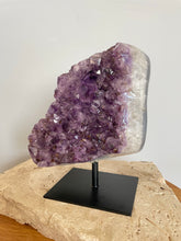 Load image into Gallery viewer, Raw Amethyst cluster with agate edge on stand