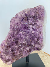 Load image into Gallery viewer, Raw Amethyst cluster with agate edge on stand