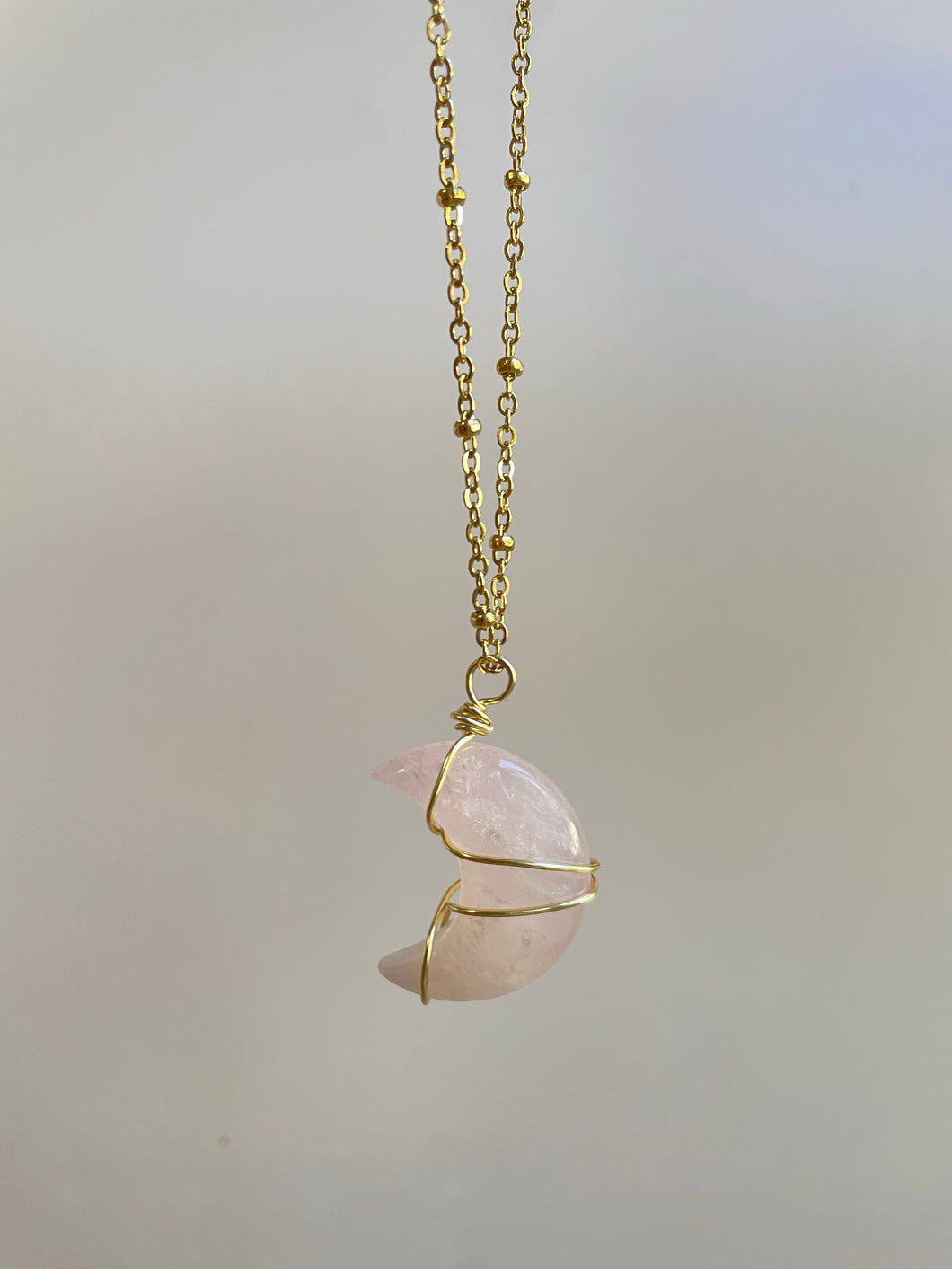 Handmade intentional conscious crystal jewellery Sydney Rose Quartz wire wrapped moon necklace